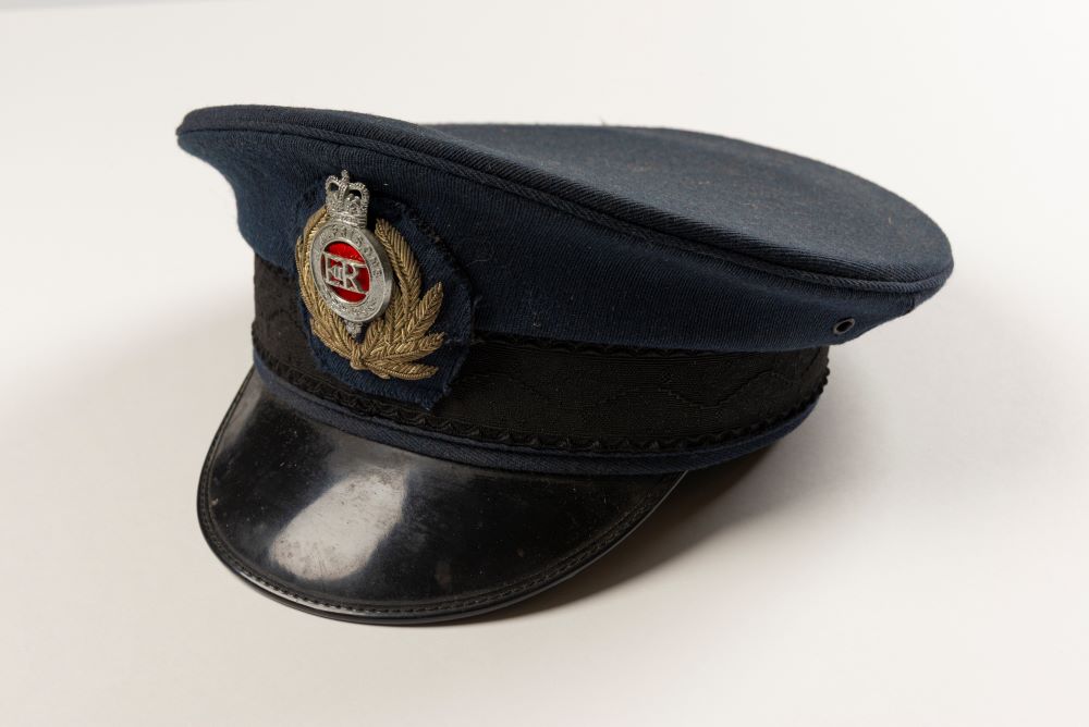 A Chief Hospital Officer's hat. The hat is navy with a black visor.