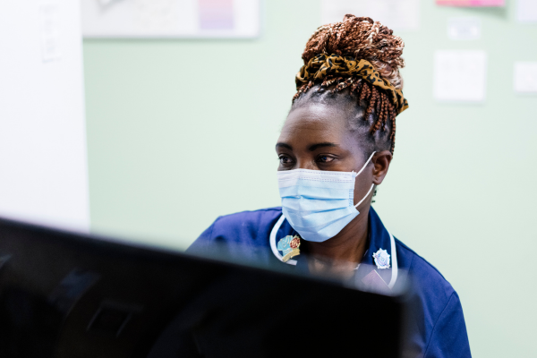 Nurse looking at computer screen