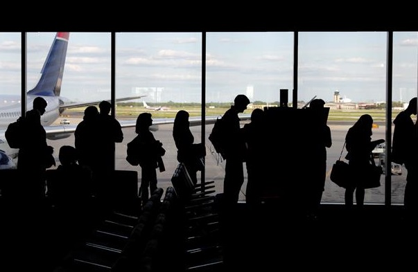 People waiting in line for an airplane
