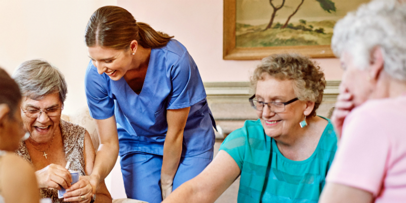 Nurse and residents in care home