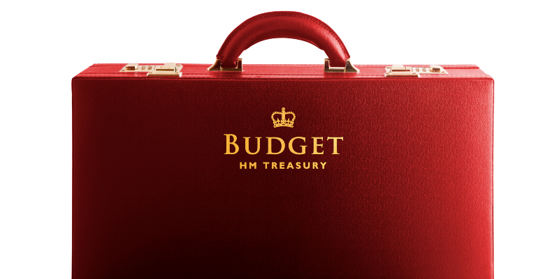 The UK chancellor's red briefcase is seen square on. It is a rich red colour with gold clasps and has the words "Budget, HM Treasury" embossed on the front in gold writing, along with a crown icon.