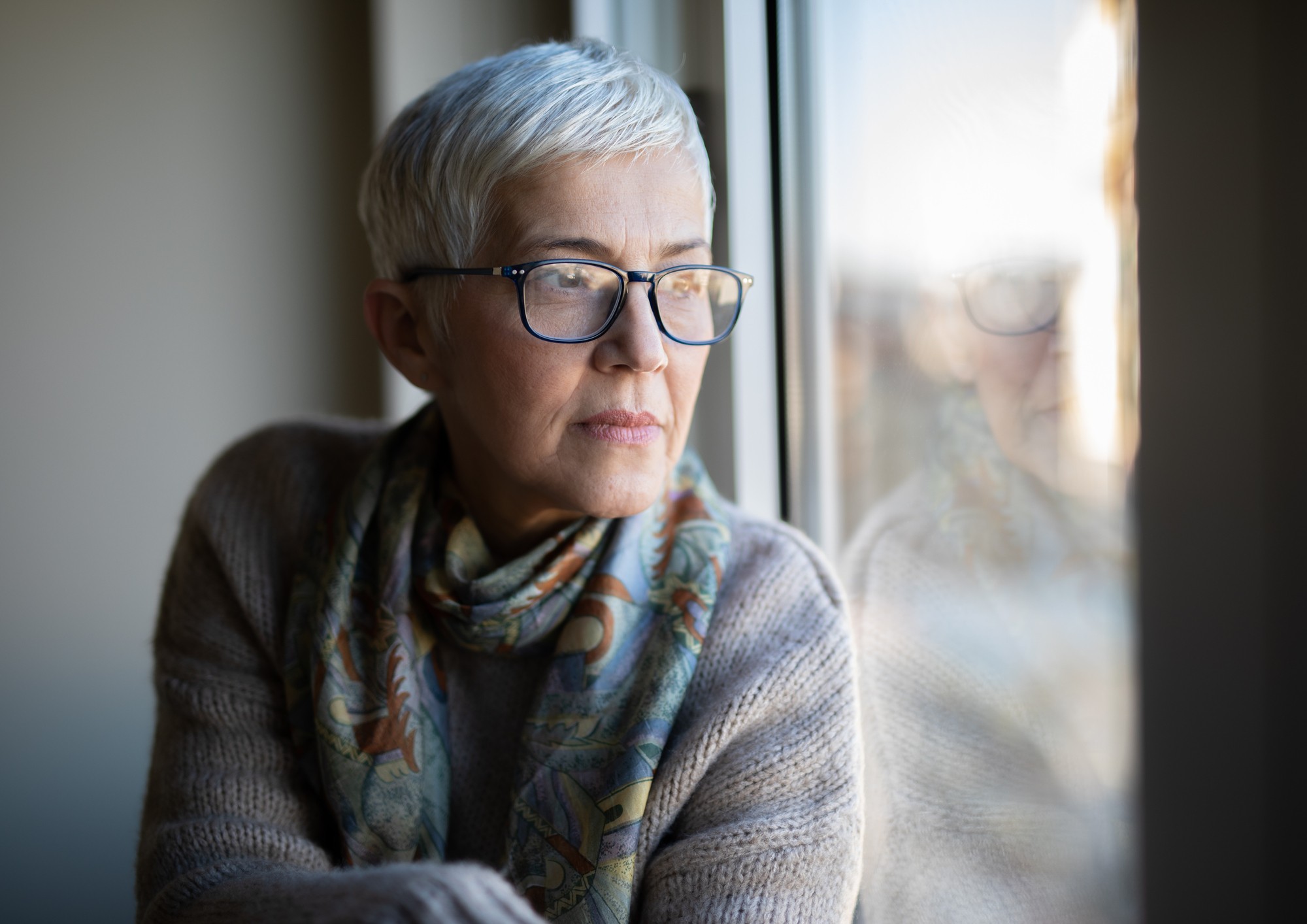 Woman looking out window