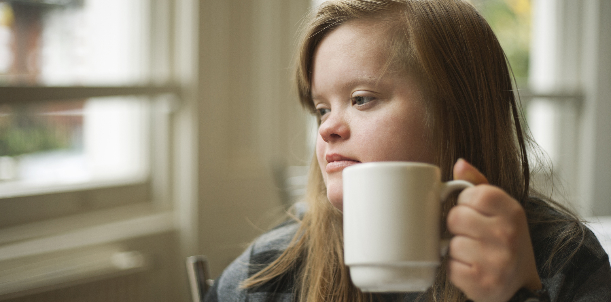 Girl drinking mug of tea