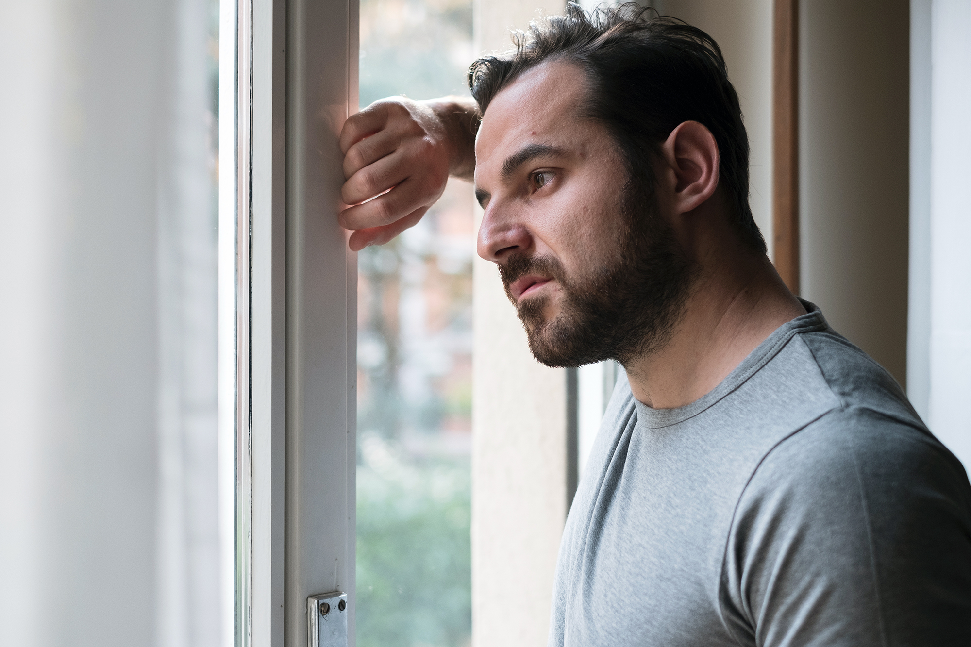 Man looking out of a window