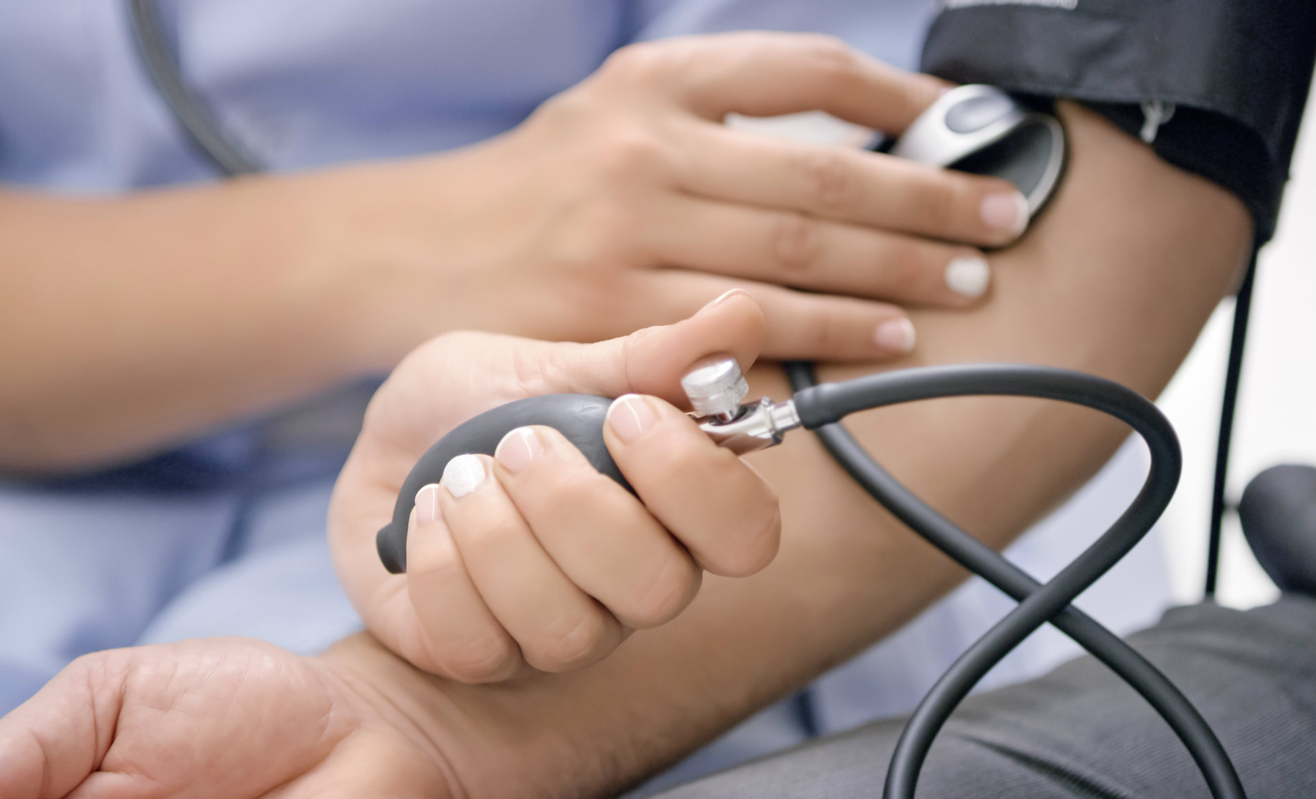 Nursing associate taking blood pressure