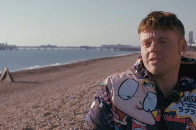 Charge nurse Sam on the seafront in Brighton being interviewed