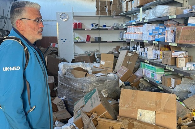 David Anderson looking at supplies in Gaza hospital