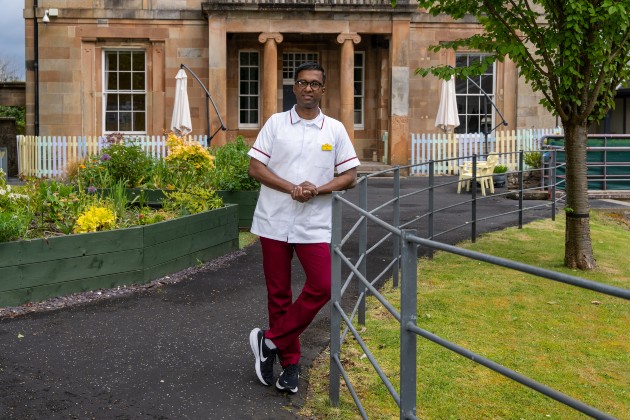 Nursing support worker Don stood outside care home