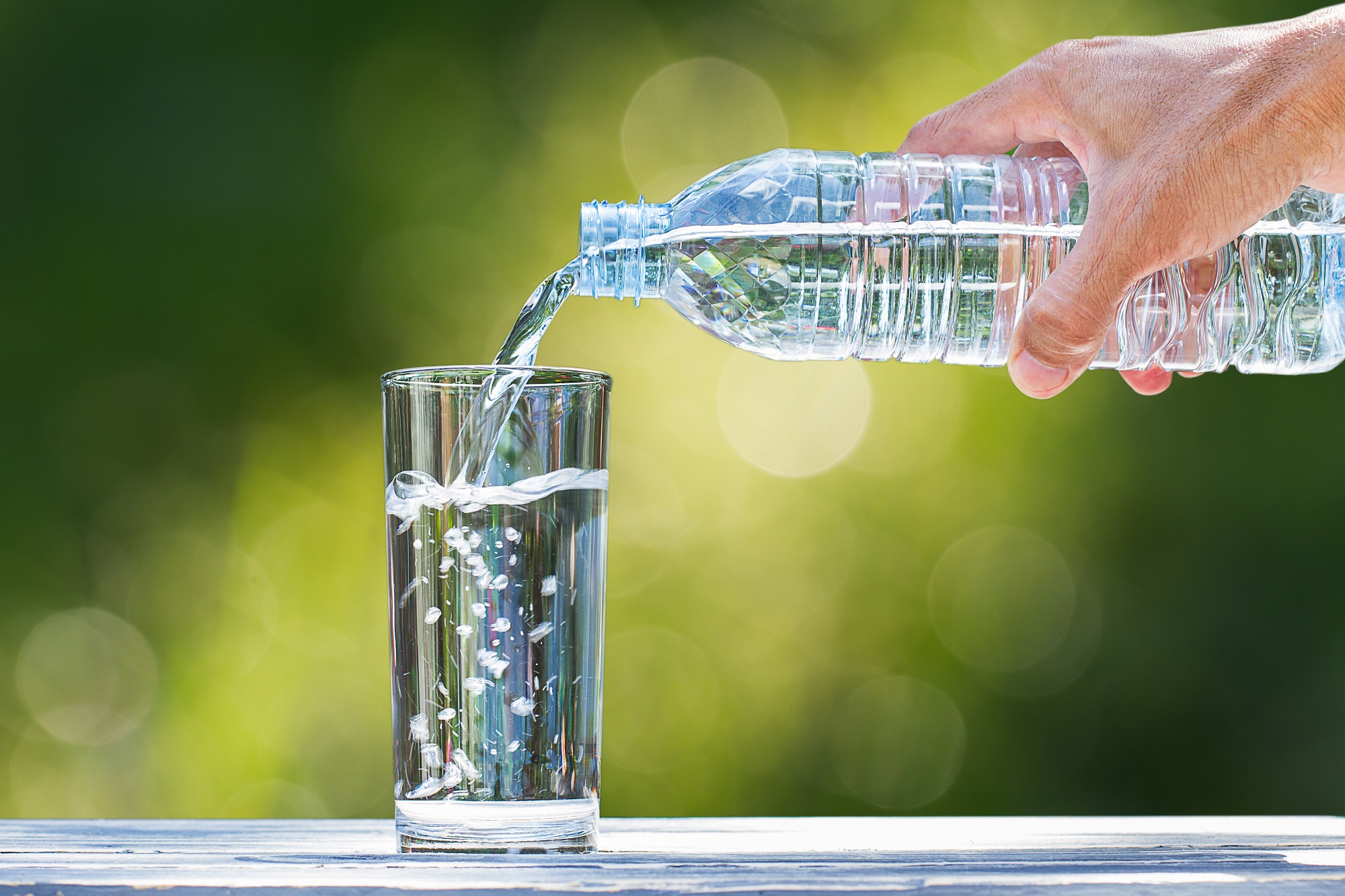 water bottle pouring into glass