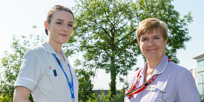 Two nursing support workers smiling