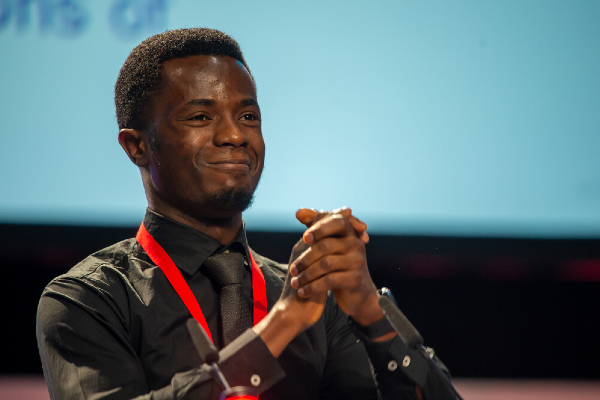 Image of man at Congress with hands clasped together
