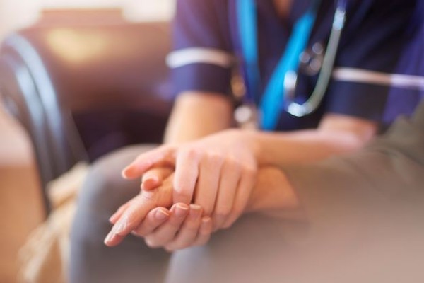 Holding hand with nurse